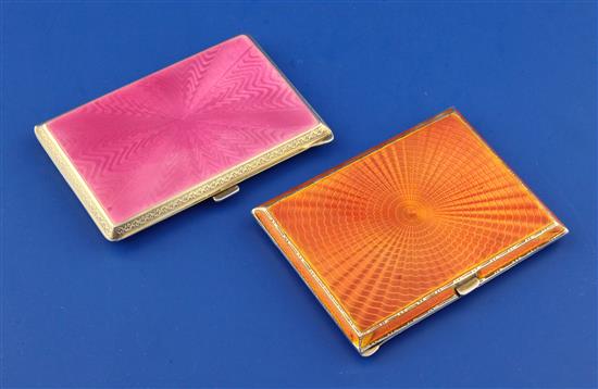 Two early 20th century silver and guilloche enamel rectangular cigarette cases, 3.5in.